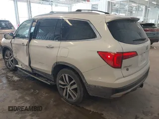 2017 Honda Pilot Touring with VIN 5FNYF6H92HB032873, listed as a IAAI auction lot 41608870 with 123,888 mi miles. Bid and sale history available at carsss.com. Image 3.