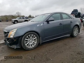 2010 Cadillac CTS Luxury with VIN 1G6DG5EG2A0149773, listed as a Copart auction lot 52730875 with 113,636 mi miles and Salvage title. Bid and sale history available at DreamBid. Image 1.