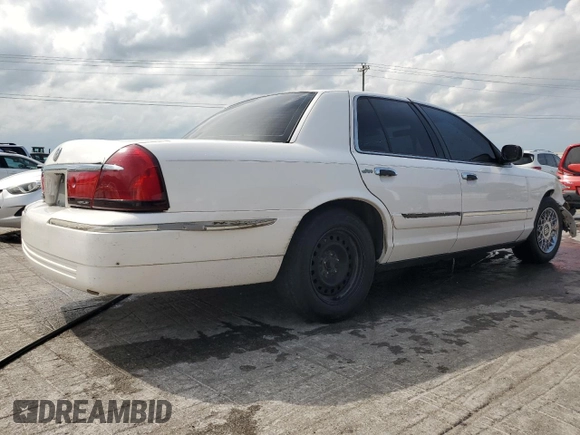 2000 Mercury Grand Marquis GS z VIN 2MEFM74WXYX699560, wystawiony jako Copart lot #57721925 z przebiegiem 246 297 mil mil oraz Szkoda całkowita • Salvage title. Historia ofert i sprzedaży dostępna na DreamBid. Obrazek 3.
