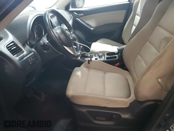 2016 Mazda CX-5 Touring z VIN JM3KE4CY4G0838908, wystawiony jako Copart lot #57961625 z przebiegiem 178 615 mil mil oraz Szkoda całkowita • Salvage title. Historia ofert i sprzedaży dostępna na DreamBid. Obrazek 7.