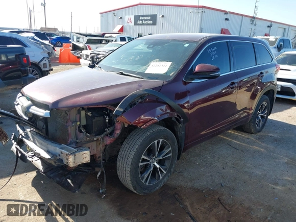 2018 Toyota Highlander LE with VIN 5TDZARFH0JS036002, listed as a IAAI auction lot 42281311 with 106,714 mi miles and . Bid and sale history available at DreamBid. Image 2.