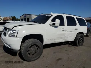 2007 Chevrolet Tahoe LTZ with VIN 1GNFC13J77R327939, listed as a Copart auction lot 79992624 with 198,443 mi miles and Salvage title. Bid and sale history available at DreamBid. Image 1.