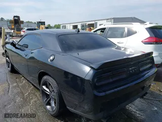 2015 Dodge Challenger SXT Plus with VIN 2C3CDZBG3FH724659, listed as a IAAI auction lot 41991083 with 148,984 mi miles. Bid and sale history available at carsss.com. Image 3.