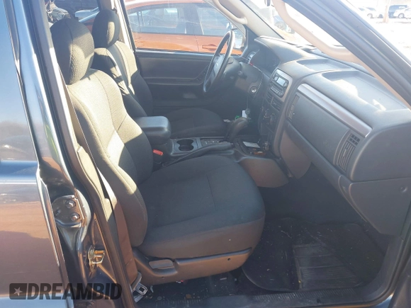 2004 Jeep Grand Cherokee Laredo z VIN 1J4GW48S24C159370, wystawiony jako IAAI lot #41296094 z przebiegiem 138 296 mil mil oraz . Historia ofert i sprzedaży dostępna na DreamBid. Obrazek 5.