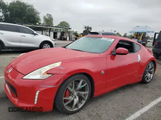 2014 Nissan 370Z Touring с VIN JN1AZ4EH2EM630346, выставлен на аукционе Copart как лот 59190645 с пробегом Не указан миль и Списание • Salvage title. История ставок и продаж доступна на DreamBid. Изображение 1.