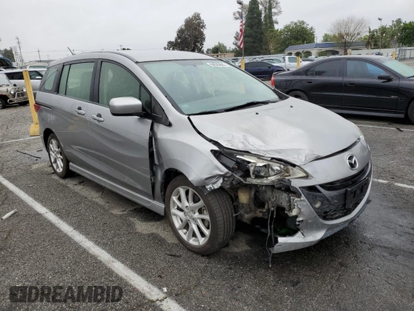 2012 Mazda 5 Touring with VIN JM1CW2CL8C0121599, listed as a Copart auction lot 50520895 with 131,948 mi miles and Salvage title. Bid and sale history available at DreamBid. Image 4.