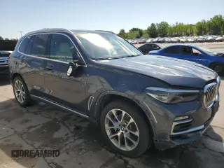 2020 BMW X5 xDrive40i with VIN 5UXCR6C06LLL75359, listed as a Copart auction lot 60897885 with 66,631 mi miles and Salvage title. Bid and sale history available at DreamBid. Image 4.