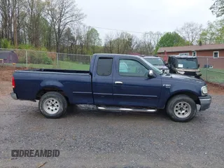 1999 Ford F-150 with VIN 1FTRX17W5XNA06036, listed as a IAAI auction lot 41897561 with 222,979 mi miles and . Bid and sale history available at DreamBid. Image 13.