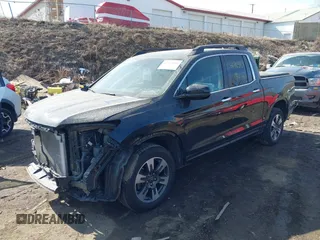 2019 Honda Ridgeline RTL-E with VIN 5FPYK3F7XKB014406, listed as a IAAI auction lot 41765154 with 65,209 mi miles and . Bid and sale history available at DreamBid. Image 2.
