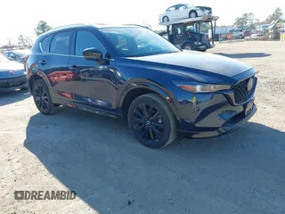 2022 Mazda CX-5 2.5 Turbo with VIN JM3KFBAY4N0534690, listed as a IAAI auction lot 41716988 with 23,910 mi miles and . Bid and sale history available at carsss.com. Image 1.