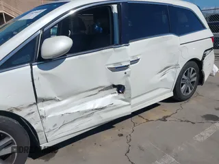 2015 Honda Odyssey Touring Elite with VIN 5FNRL5H91FB038099, listed as a IAAI auction lot 41829649 with 167,017 mi miles and . Bid and sale history available at DreamBid. Image 6.