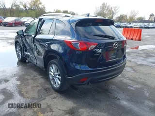 2015 Mazda CX-5 Grand Touring with VIN JM3KE4DY7F0478823, listed as a IAAI auction lot 40731626 with 82,884 mi miles. Bid and sale history available at carsss.com. Image 3.