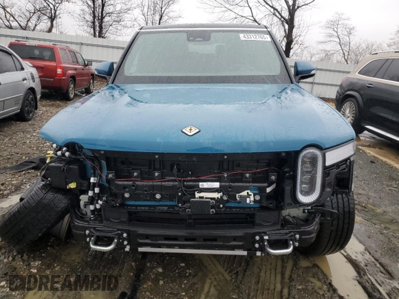 2024 Rivian R1S Adventure z VIN 7PDSGABA1RN031444, wystawiony jako Copart lot #43312765 z przebiegiem Nie podano mil oraz Szkody całkowita. Historia ofert i sprzedaży dostępna na DreamBid. Obrazek 5.