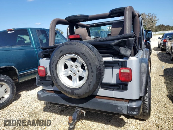 2004 Jeep Wrangler Sport with VIN 1J4FA49SX4P776775, listed as a Copart auction lot 74946824 with Not Provided miles and Salvage Title. Bid and sale history available at carsss.com. Image 6.
