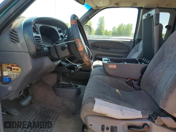 1999 Dodge 2500 with VIN 1B7KF23W2XJ539940, listed as a Copart auction lot 64237595 with 211,718 mi miles and Salvage title. Bid and sale history available at DreamBid. Image 7.