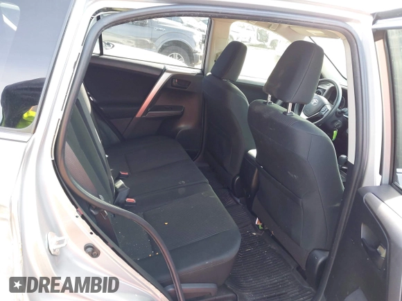 2018 Toyota RAV4 LE with VIN JTMBFREV8JJ224872, listed as a IAAI auction lot 41907962 with 104,605 mi miles and . Bid and sale history available at DreamBid. Image 8.