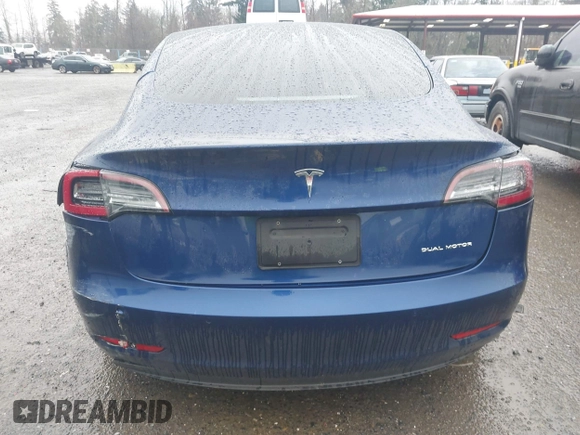 2022 Tesla Model 3 Long Range with VIN 5YJ3E1EB1NF142574, listed as a IAAI auction lot 41213900 with 127,404 mi miles and . Bid and sale history available at DreamBid. Image 16.