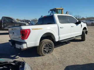 2023 Ford F-150 XL with VIN 1FTFW1E56PFC91467, listed as a IAAI auction lot 41030658 with 31,325 mi miles. Bid and sale history available at carsss.com. Image 4.