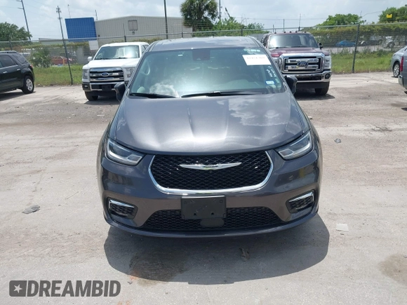 2023 Chrysler Pacifica Touring L with VIN 2C4RC1BG6PR590302, listed as a IAAI auction lot 42451369 with 72,097 mi miles and . Bid and sale history available at DreamBid. Image 12.