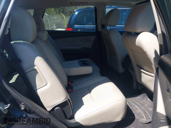 2015 Mazda CX-9 Touring with VIN JM3TB3CV1F0461854, listed as a IAAI auction lot 42068299 with 128,124 mi miles. Bid and sale history available at carsss.com. Image 8.