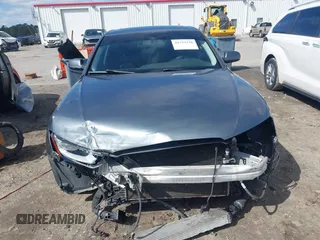 2014 Audi A4 Premium z VIN WAUAFAFL1EN024888, wystawiony jako IAAI lot #41733326 z przebiegiem 117 232 mil mil oraz . Historia ofert i sprzedaży dostępna na DreamBid. Obrazek 13.