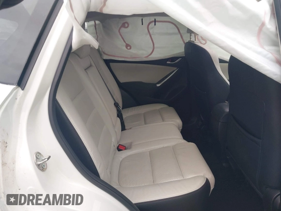 2016 Mazda CX-5 Grand Touring z VIN JM3KE2DY8G0885006, wystawiony jako IAAI lot #41615873 z przebiegiem 118 890 mil mil oraz . Historia ofert i sprzedaży dostępna na DreamBid. Obrazek 8.