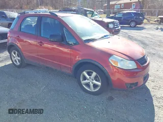 2009 Suzuki SX4 Man Touring Pkg AWD with VIN JS2YB417595100925, listed as a IAAI auction lot 41693882 with 76,972 mi miles. Bid and sale history available at carsss.com. Image 1.