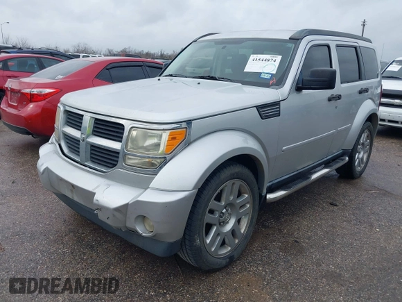 2008 Dodge Nitro SLT with VIN 1D8GT58K58W127412, listed as a IAAI auction lot 41544874 with 232,748 mi miles. Bid and sale history available at carsss.com. Image 2.