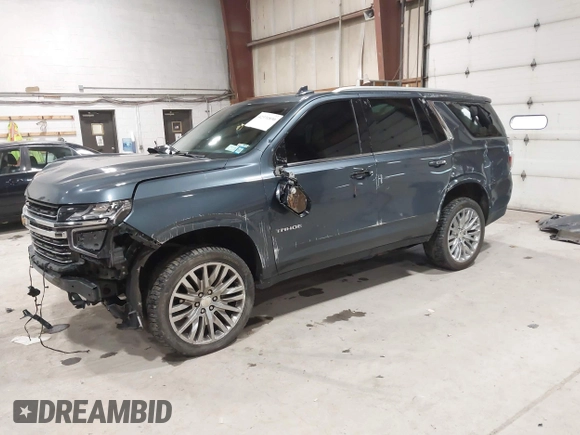 2021 Chevrolet Tahoe LT z VIN 1GNSKNKD5MR354265, wystawiony jako IAAI lot #42331890 z przebiegiem 106 250 mil mil oraz . Historia ofert i sprzedaży dostępna na DreamBid. Obrazek 18.