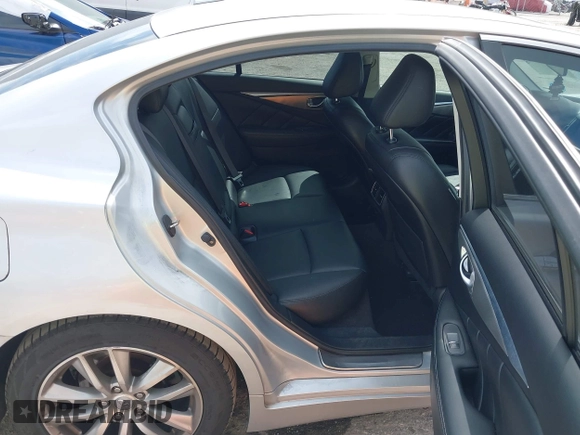2014 Infiniti Q50 Premium z VIN JN1BV7AP9EM690381, wystawiony jako IAAI lot #41761562 z przebiegiem 107 099 mil mil oraz . Historia ofert i sprzedaży dostępna na DreamBid. Obrazek 8.