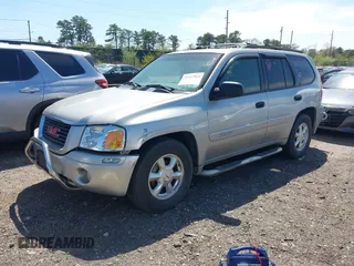 2004 GMC Envoy SLE with VIN 1GKDT13S042113411, listed as a IAAI auction lot 42117824 with 116,827 mi miles. Bid and sale history available at carsss.com. Image 2.