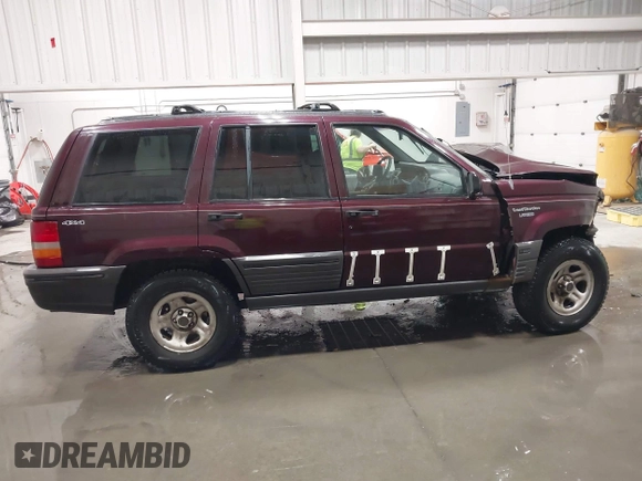 1995 Jeep Grand Cherokee Laredo with VIN 1J4GZ58S2SC679918, listed as a IAAI auction lot 41840415 with 261,434 mi miles. Bid and sale history available at carsss.com. Image 13.