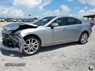 2014 Mazda 6 i Touring with VIN JM1GJ1V68E1119740, listed as a Copart auction lot 62335385 with 89,181 mi miles and Salvage title. Bid and sale history available at DreamBid. Image 1.