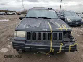 1998 Jeep Grand Cherokee Limited with VIN 1J4GZ78Y7WC163186, listed as a Copart auction lot 75011954 with 247,991 mi miles and Salvage Title. Bid and sale history available at carsss.com. Image 5.