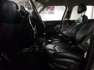 2015 MINI Cooper Countryman S with VIN WMWZC5C51FWM18945, listed as a Copart auction lot 45018755 with 135,086 mi miles and Salvage Title. Bid and sale history available at carsss.com. Image 7.