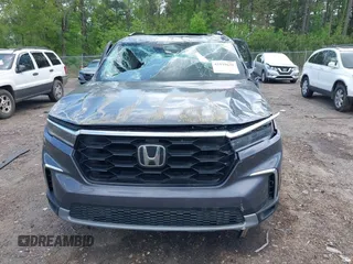 2024 Honda Pilot Touring with VIN 5FNYG2H7XRB014420, listed as a IAAI auction lot 41919635 with Not provided miles and . Bid and sale history available at DreamBid. Image 6.
