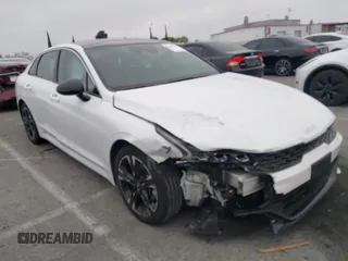 2022 Kia K5 GT-Line z VIN 5XXG64J22NG157992, wystawiony jako IAAI lot #42120914 z przebiegiem 39 994 mil mil oraz . Historia ofert i sprzedaży dostępna na DreamBid. Obrazek 1.