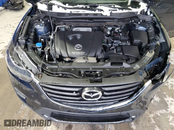 2016 Mazda CX-5 Grand Touring with VIN JM3KE4DY9G0708024, listed as a Copart auction lot 44689995 with 113,002 mi miles and Salvage Title. Bid and sale history available at DreamBid. Image 12.