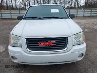 2004 GMC Envoy SLE with VIN 1GKDT13SX42357048, listed as a IAAI auction lot 41601126 with 304,101 mi miles. Bid and sale history available at carsss.com. Image 6.