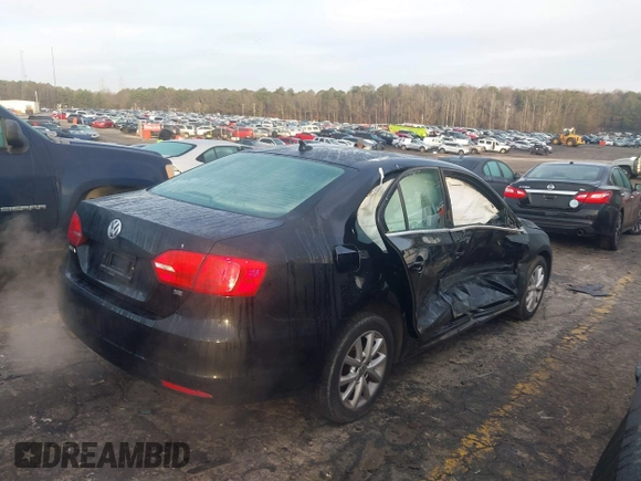 2014 Volkswagen Jetta Sedan SE with VIN 3VWD17AJ1EM322226, listed as a IAAI auction lot 41211984 with 217,084 mi miles. Bid and sale history available at carsss.com. Image 4.