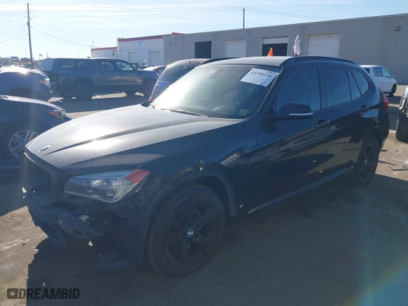 2014 BMW X1 xDrive28i with VIN WBAVL1C58EVY11143, listed as a IAAI auction lot 41396236 with 115,667 mi miles. Bid and sale history available at carsss.com. Image 2.