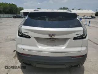 2020 Cadillac XT4 FWD Sport with VIN 1GYFZER49LF123830, listed as a Copart auction lot 55737985 with 98,871 mi miles and Salvage title. Bid and sale history available at DreamBid. Image 6.