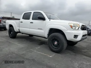2014 Toyota Tacoma PreRunner with VIN 3TMKU4HN9EM040957, listed as a Copart auction lot 76579404 with 91,222 mi miles and Salvage title. Bid and sale history available at DreamBid. Image 4.