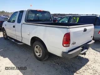 2003 Ford F-150 XL with VIN 1FTRX172X3NA59676, listed as a IAAI auction lot 41821013 with 249,483 mi miles. Bid and sale history available at carsss.com. Image 3.