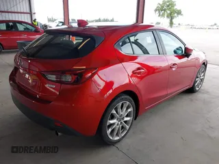 2014 Mazda 3 S Grand Touring with VIN JM1BM1M38E1200696, listed as a IAAI auction lot 41906426 with 50,048 mi miles and . Bid and sale history available at DreamBid. Image 4.