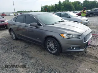 2013 Ford Fusion SE Hybrid z VIN 3FA6P0LU1DR315938, wystawiony jako IAAI lot #42383852 z przebiegiem 250 285 mil mil oraz . Historia ofert i sprzedaży dostępna na DreamBid. Obrazek 1.