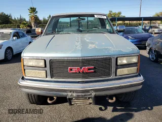 1990 GMC Sierra 2500 z VIN 1GTGK24K9LE552815, wystawiony jako Copart lot #76828874 z przebiegiem 211 977 mil mil oraz Szkody całkowita. Historia ofert i sprzedaży dostępna na DreamBid. Obrazek 5.