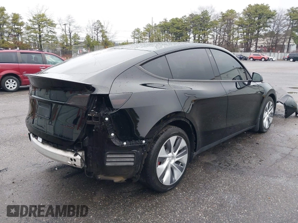 2022 Tesla Model Y Performance with VIN 7SAYGDEF7NF403701, listed as a IAAI auction lot 41961532 with 83,728 mi miles and . Bid and sale history available at DreamBid. Image 4.