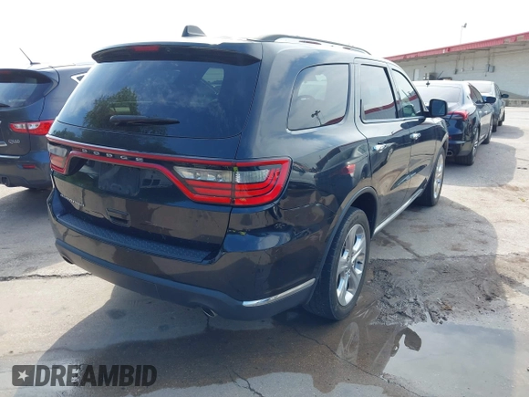 2015 Dodge Durango SXT with VIN 1C4RDHAG3FC127841, listed as a IAAI auction lot 42693953 with 214,854 mi miles and . Bid and sale history available at DreamBid. Image 4.
