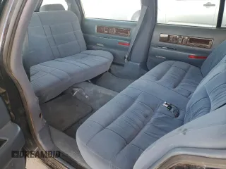 1996 Cadillac Fleetwood z VIN 1G6DW52P2TR710009, wystawiony jako Copart lot #67530934 z przebiegiem 127 910 mil mil oraz Tytuł czysty. Historia ofert i sprzedaży dostępna na DreamBid. Obrazek 10.